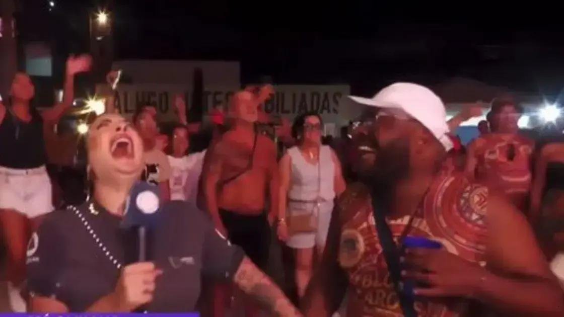 Repórter cai na gargalhada após resposta inusitada de folião